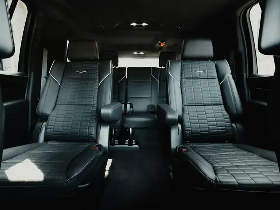 Leather captain's chairs inside a luxury executive vehicle