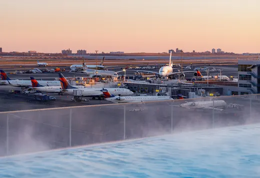 Aircraft at the gates of JFK International Airport at sunset